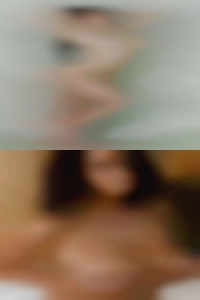 Has beautiful adult DD breasts.